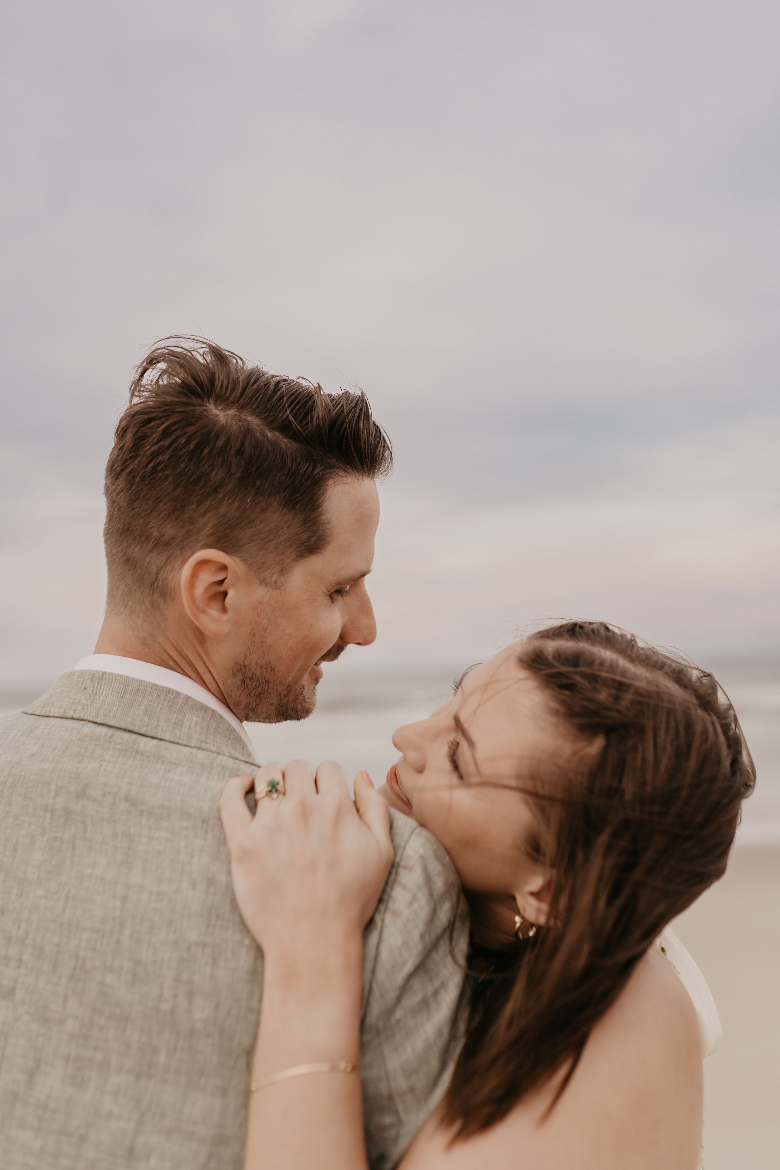 wedding couple posing on a beach in north carolina