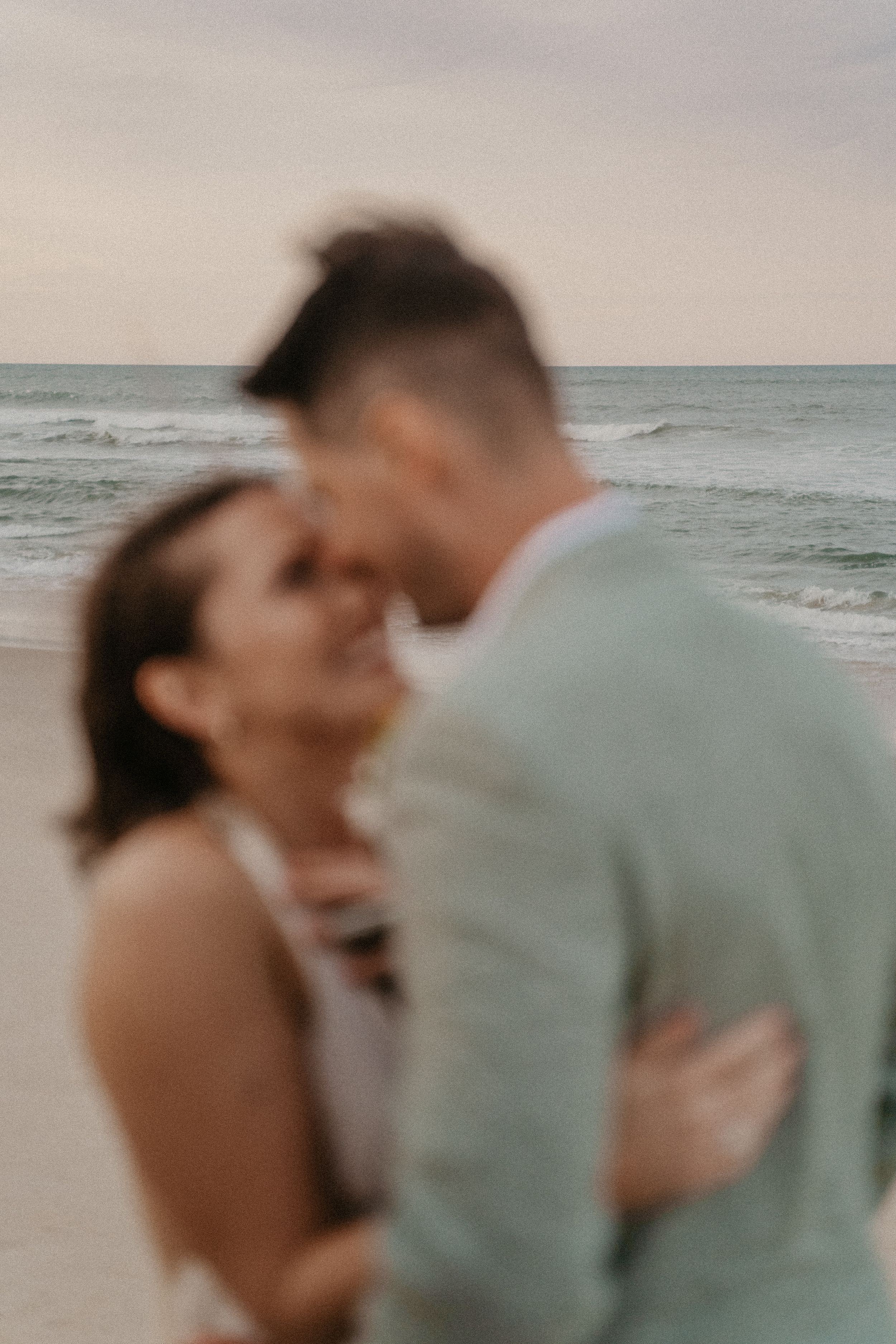 wedding couple posing on a beach in north carolina