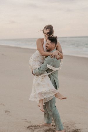 wedding couple posing on a beach in north carolina