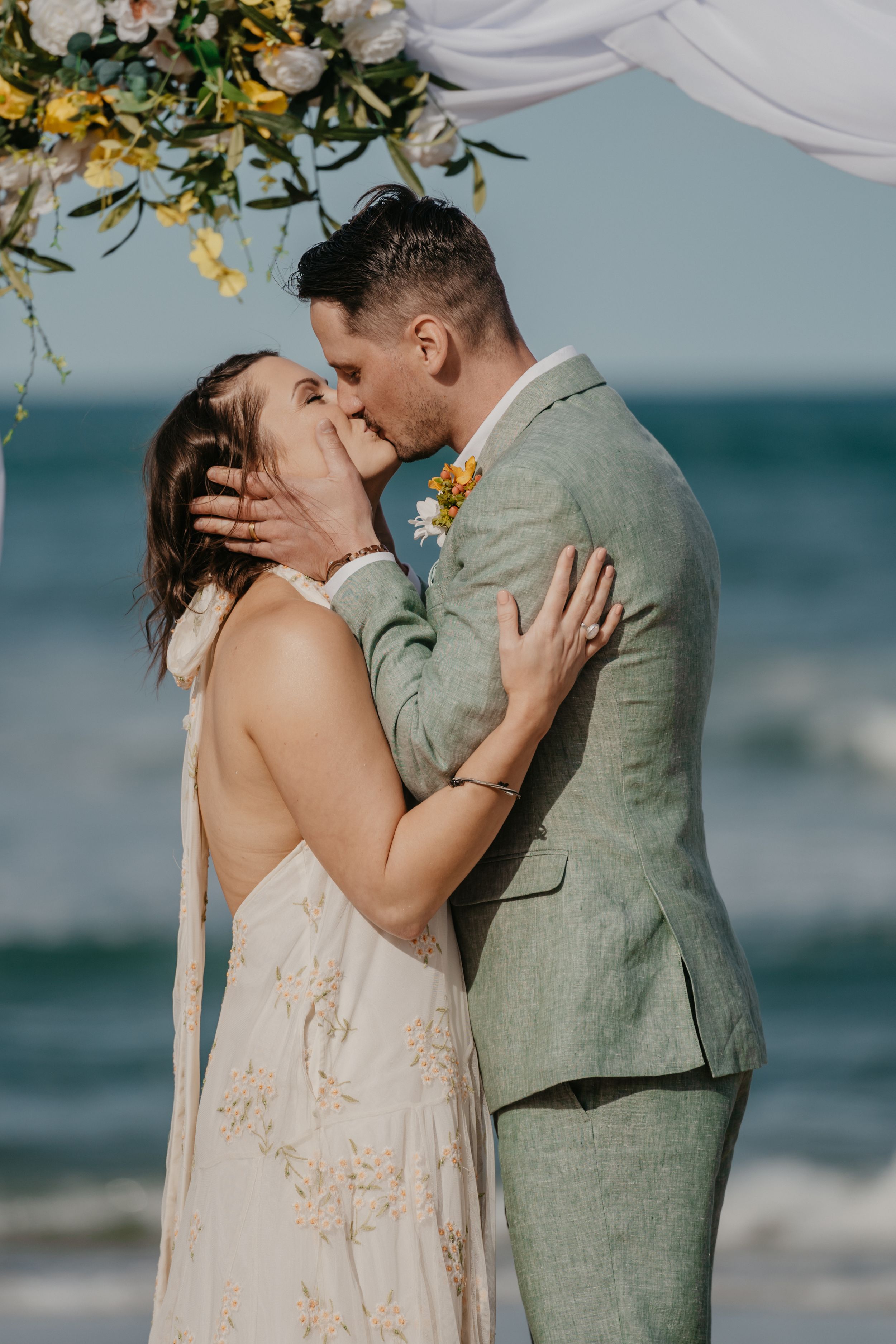 wedding couple posing on a beach in north carolina