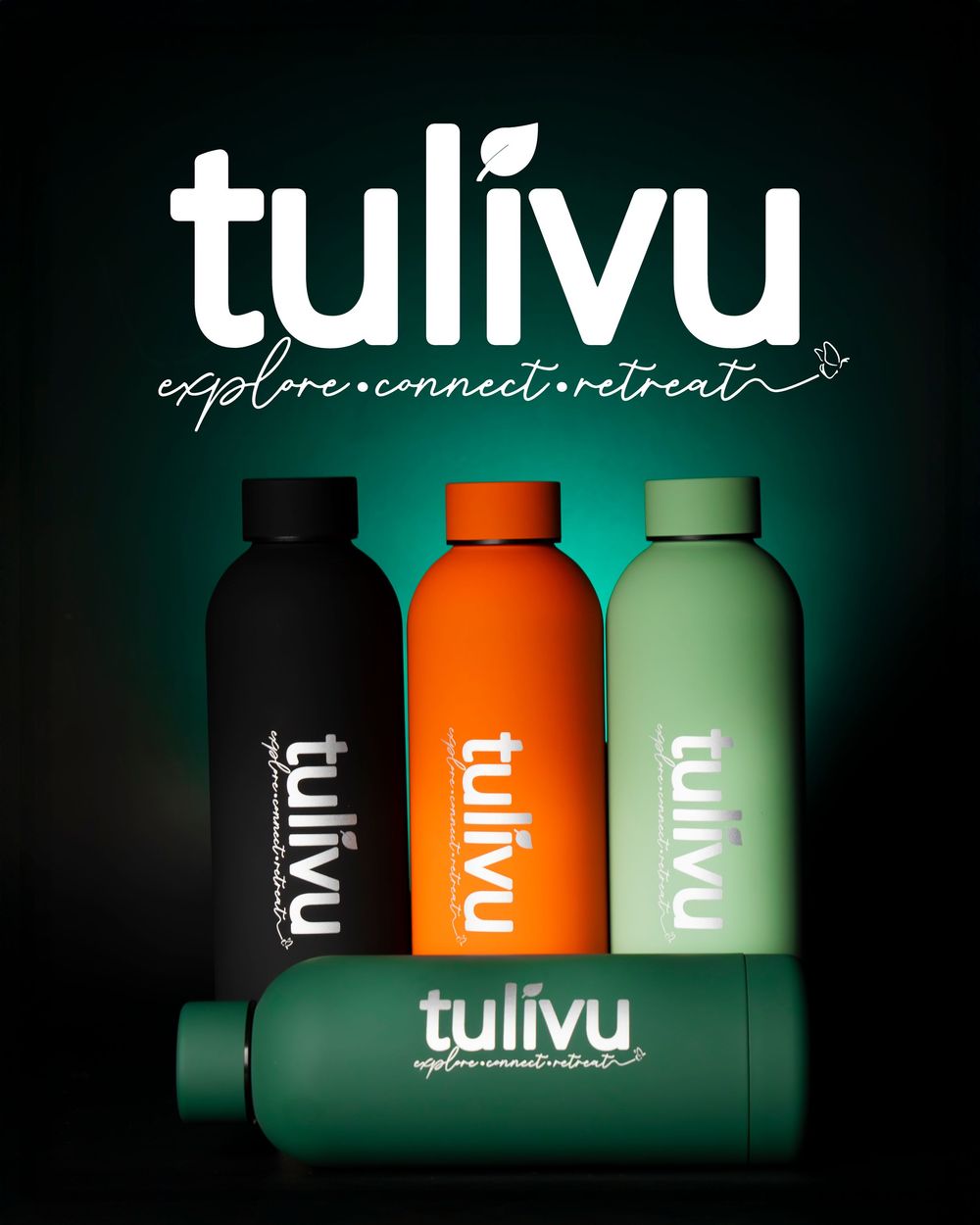 Three tulivu branded water bottles in black, orange, and green with explore connect retreat tagline.