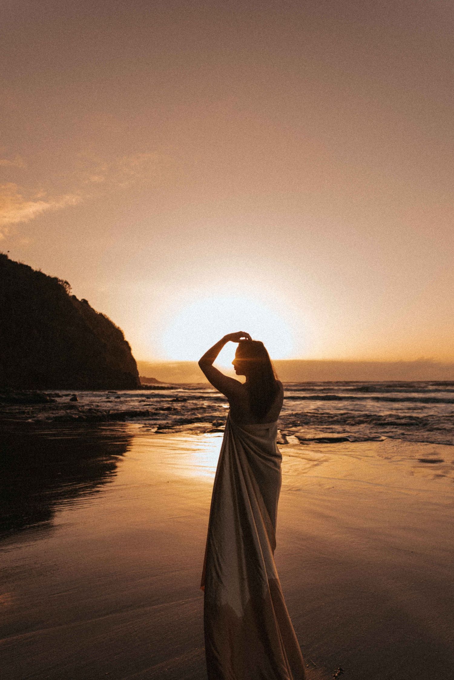 Outdoor portrait photography New Zealand — golden hour beach session, Raglan