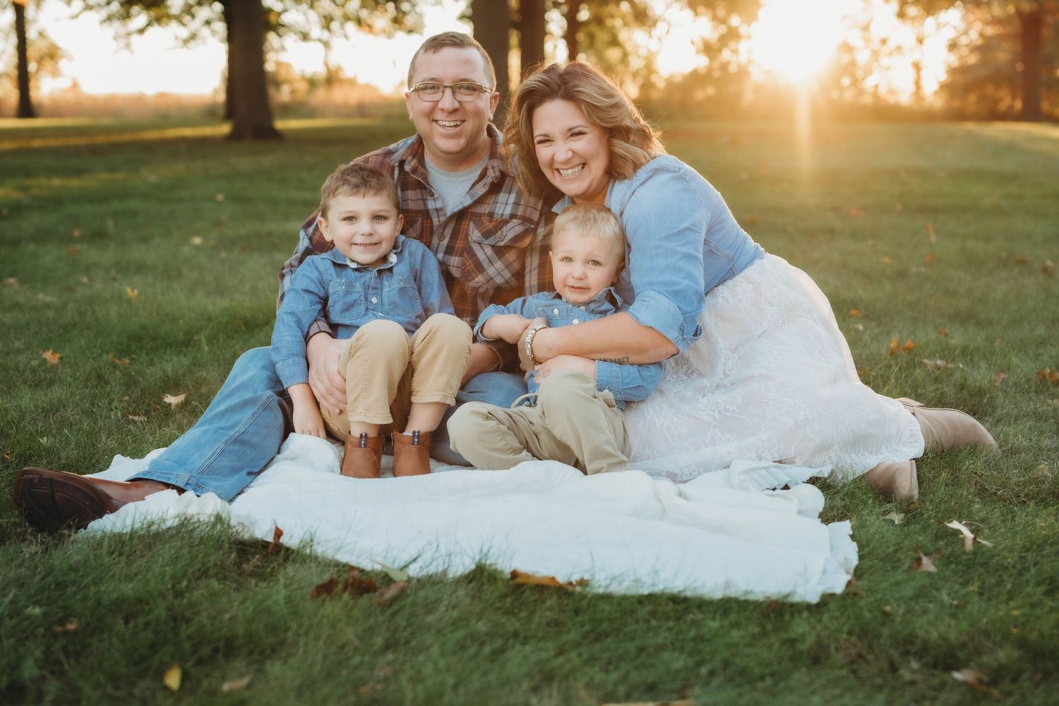 family photo, sunset, golden hour, on the grass