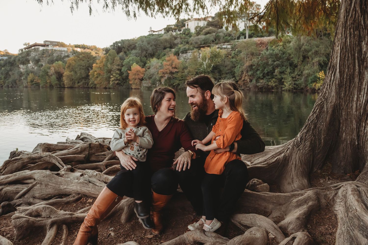 Happy family sharing joyful moment together at sunset outdoors.