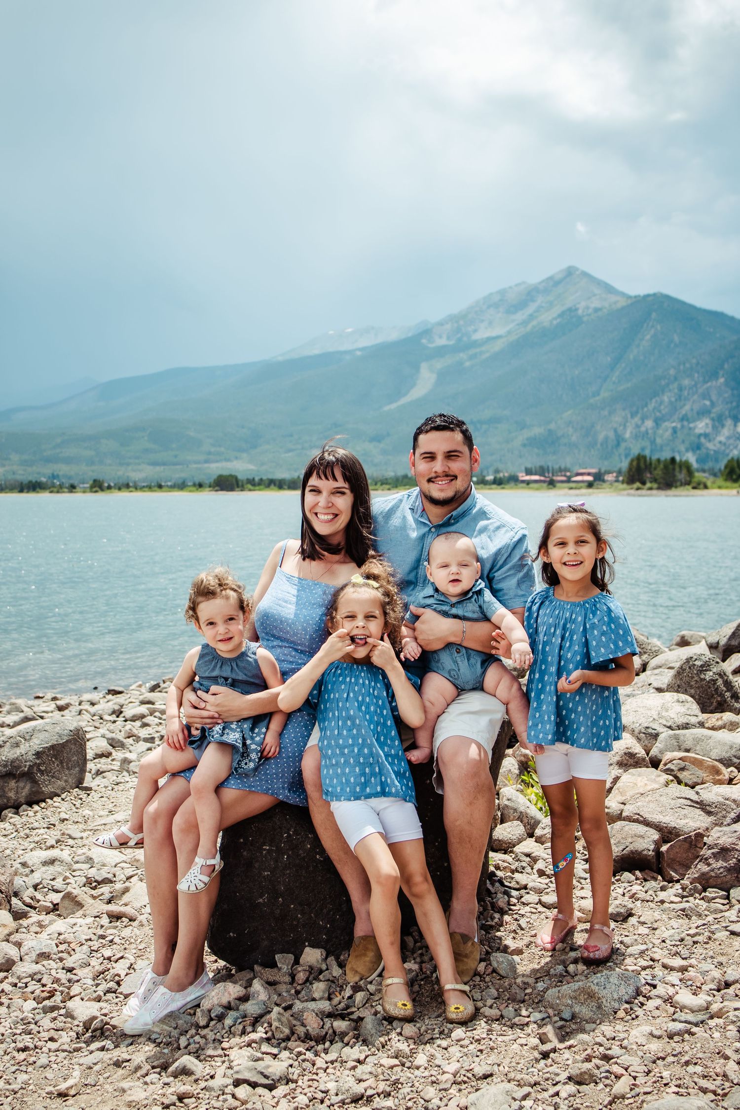Colorado family posing in the mountains during their family photo session. Family Photographer based in Denver Colorado.