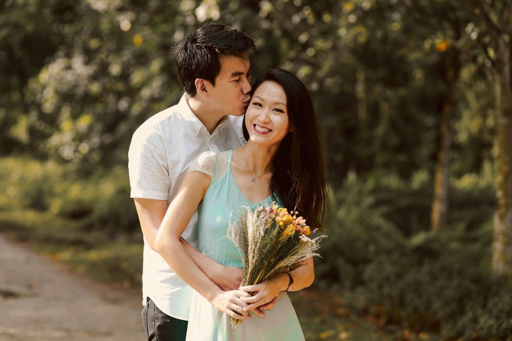 Engagement prewedding shoot of a couple during an outdoor, nature photoshoot in Singapore