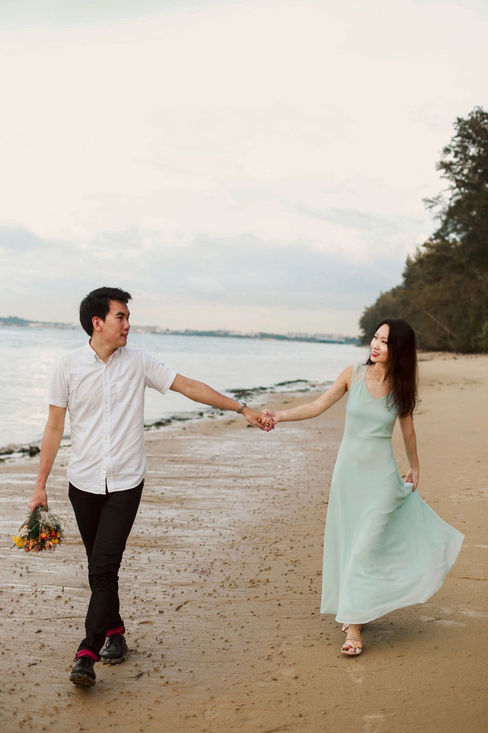 Engagement prewedding shoot of a couple during an outdoor, nature photoshoot in Singapore