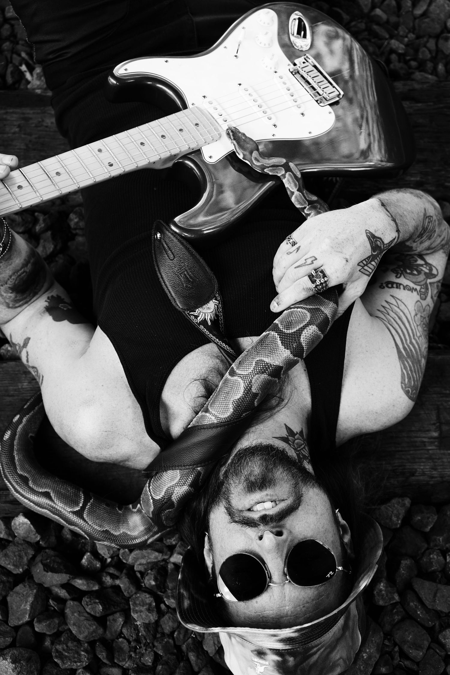 Artistic black and white photos of guitars and skulls in dramatic lighting.