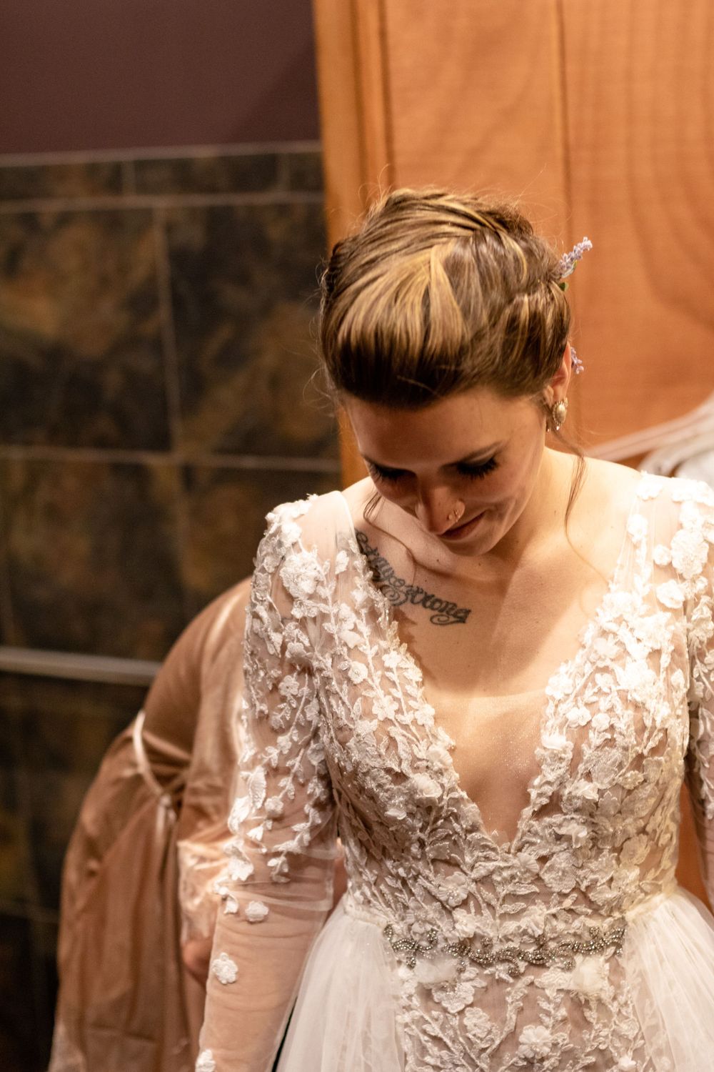 putting the wedding dress on