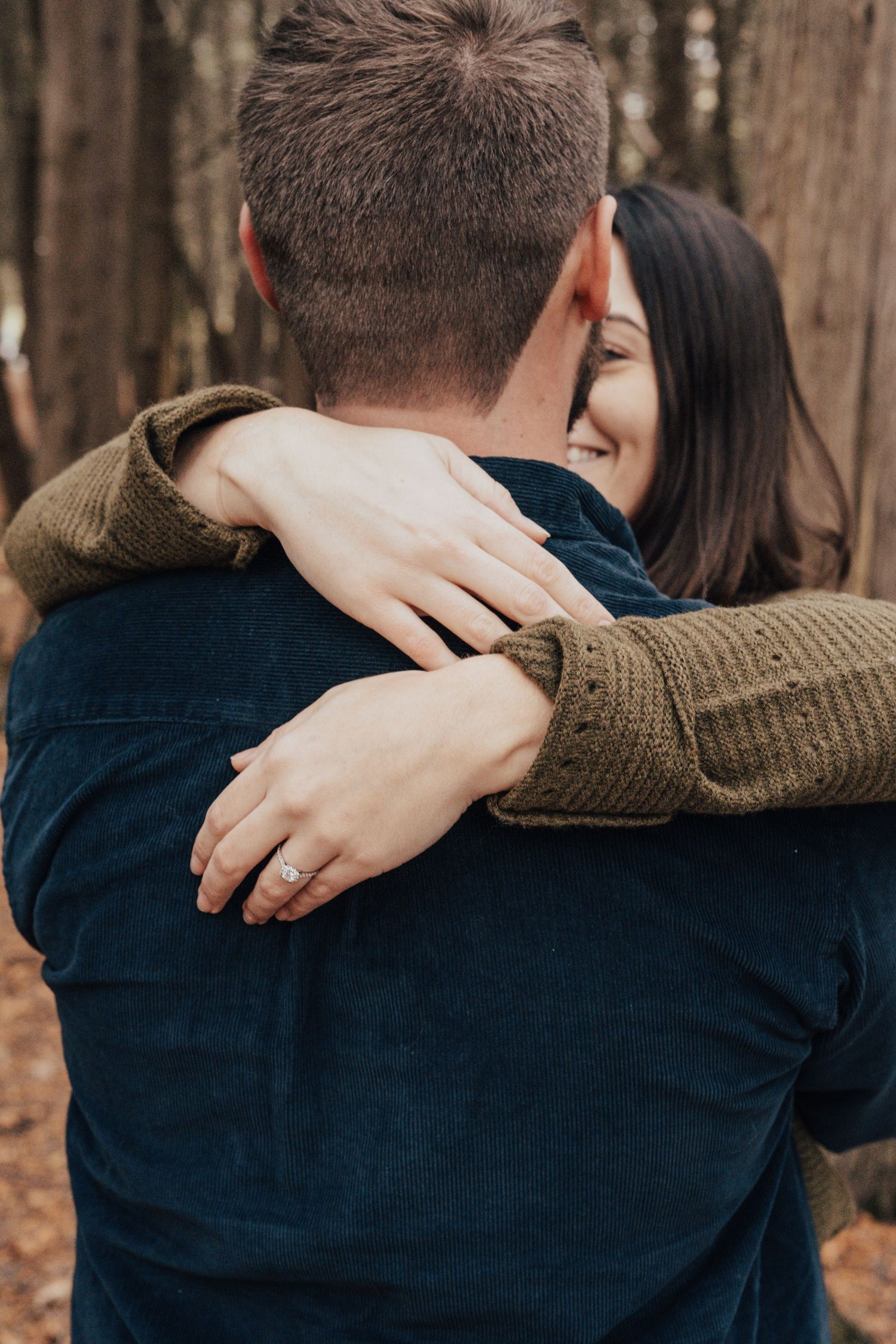 Image of woman and man hugging with hands showing over man's back.