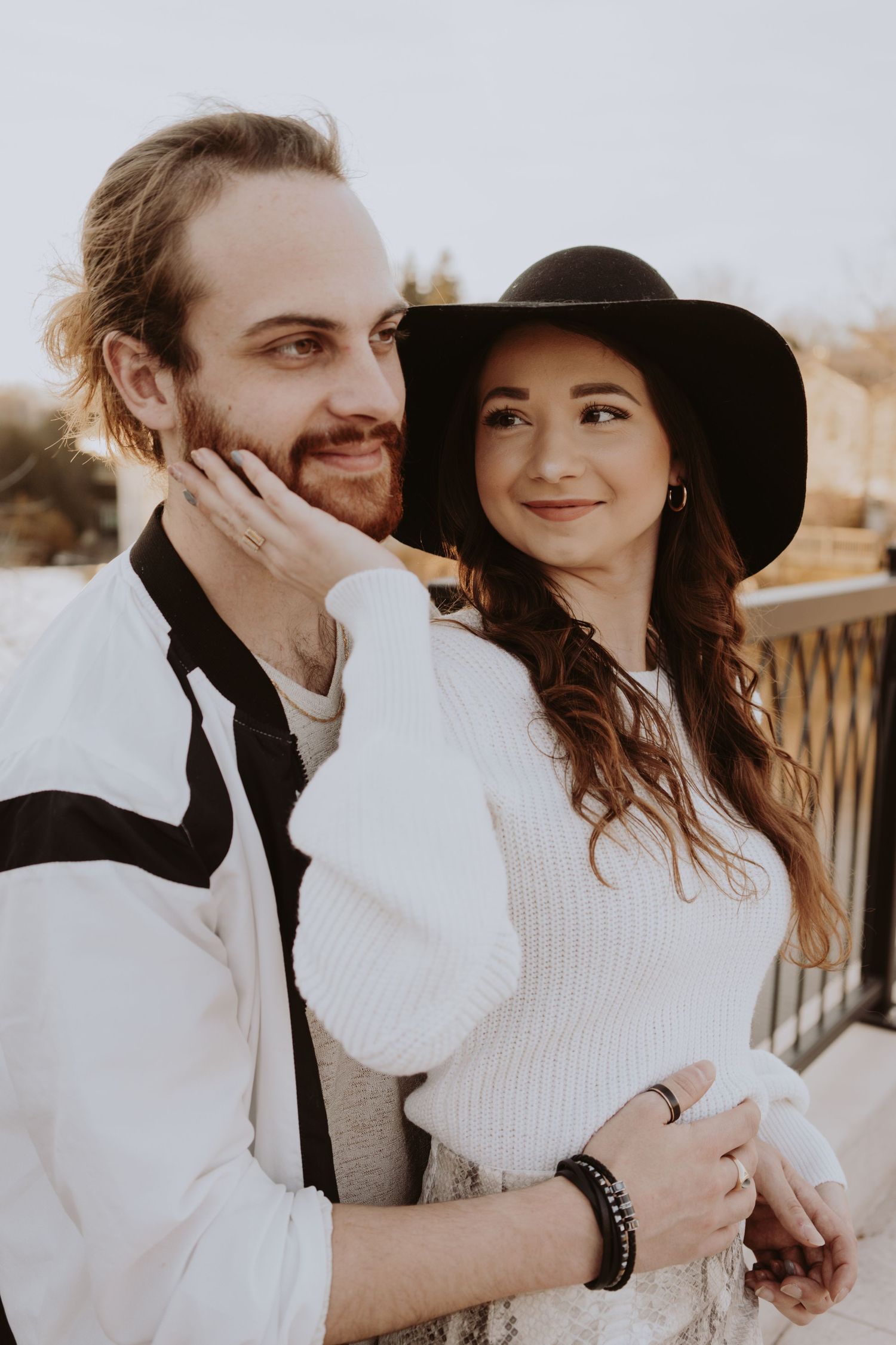 Image of woman caressing man's face.
