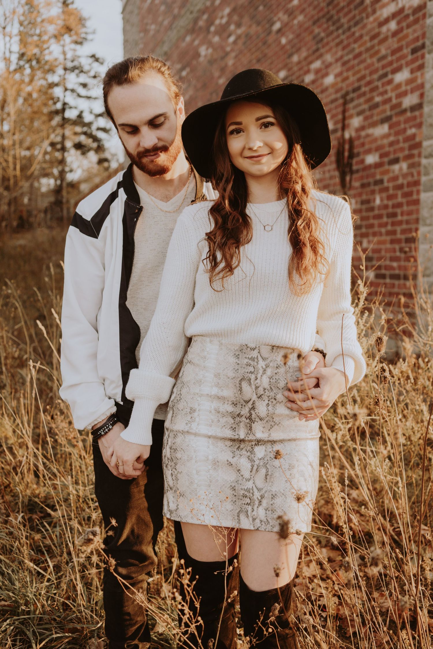 Image of woman and man in field of tall grass.