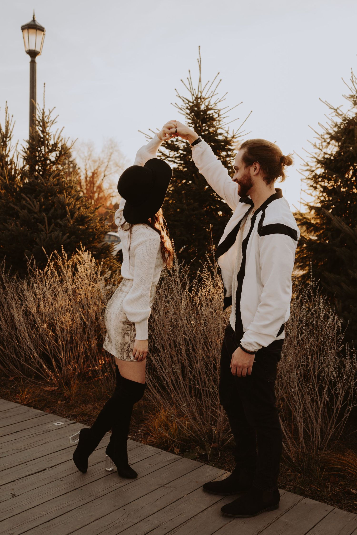 Image of woman and man dancing on path.