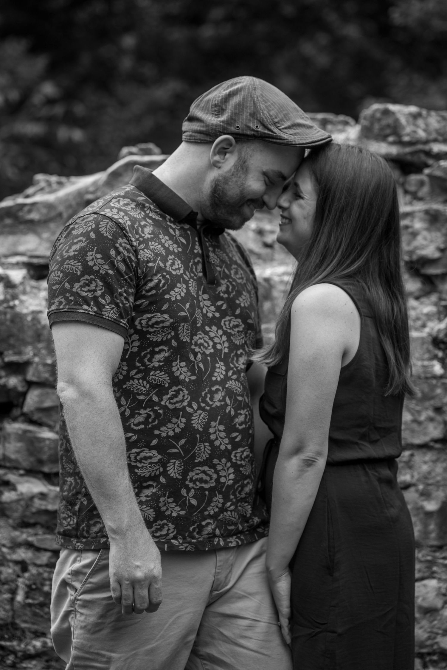 Image of woman and man touching foreheads and smiling.