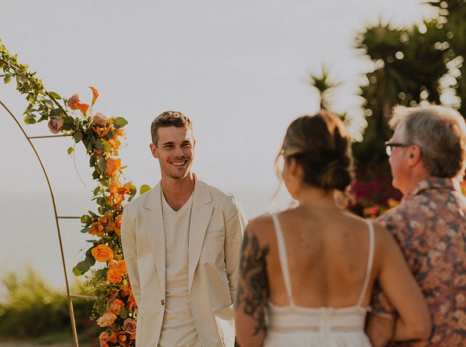 Shot of groom seeing bride in Palos Verdes cliffs wedding overlooking the ocean
