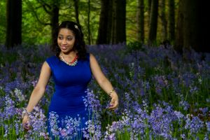 lady standing in the spring bluebells