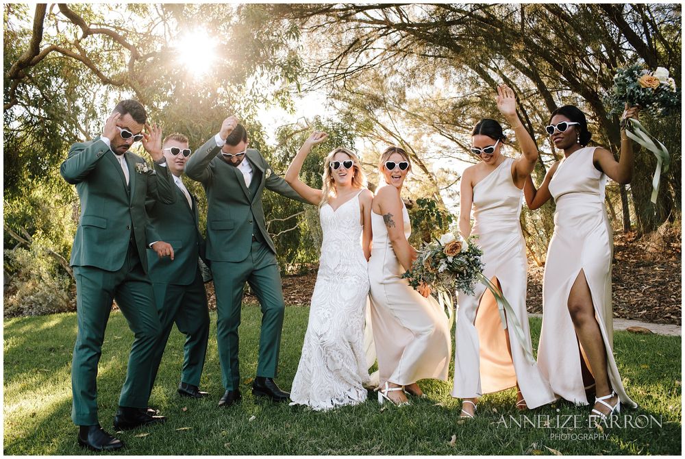 Bridal party having fun after the ceremony with the sunglasses