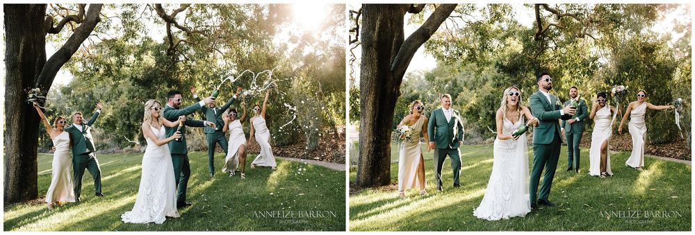 Bridal party popping the champagne