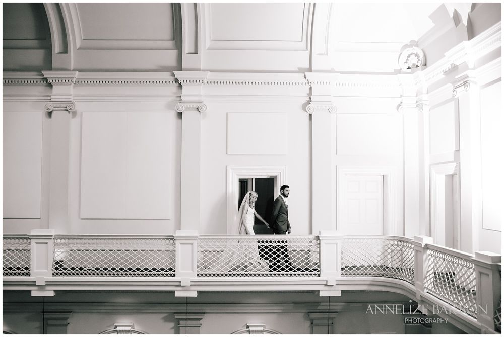 Bride and groom walking on the balcony at this COMO the Treasury wedding