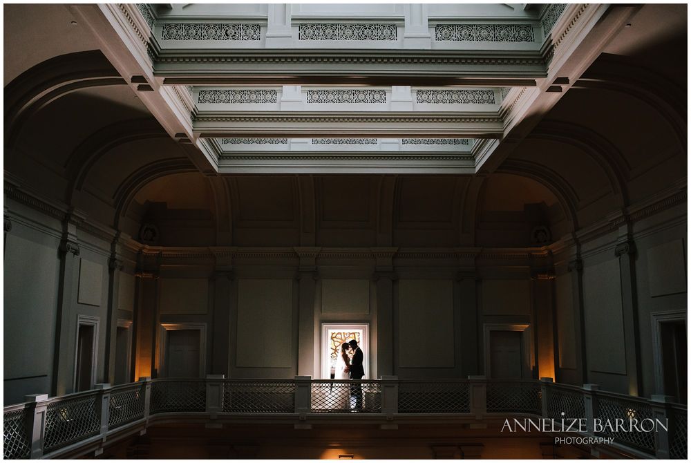 Bride and groom on the balcony at this COMO the Treasury wedding