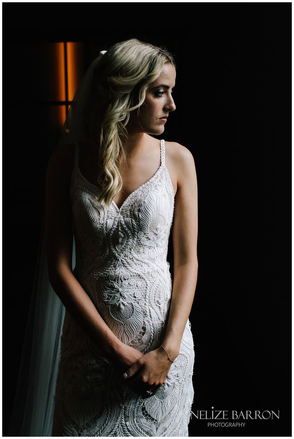 Bride looking out the window at this COMO the Treasury wedding