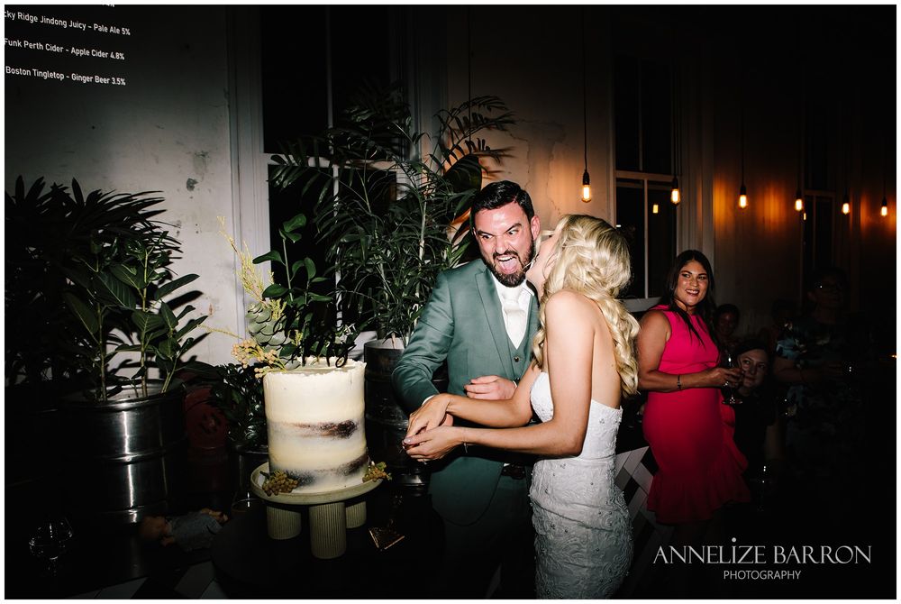 Bride and groom cutting the cake