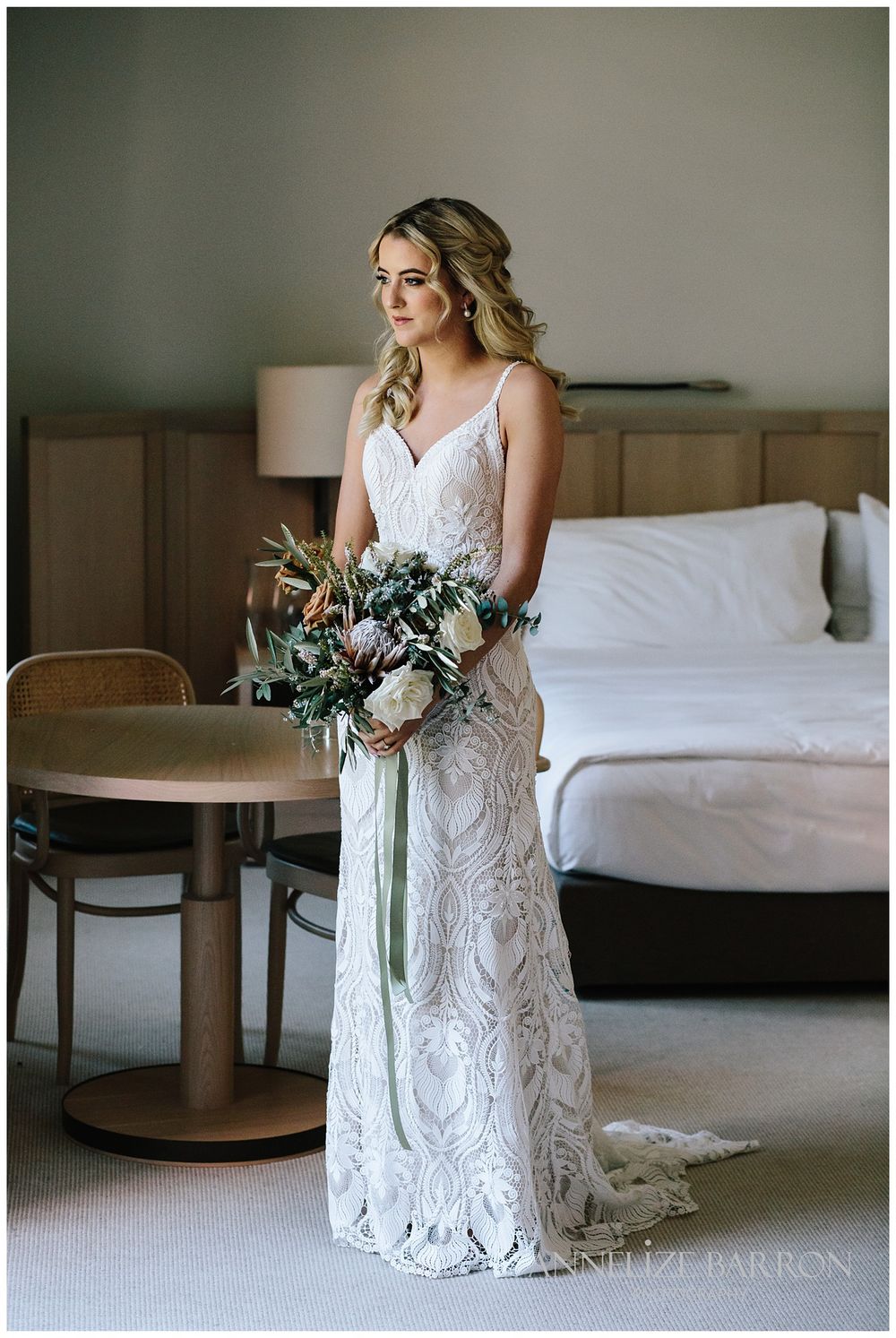 Portrait of the bride holding her bouquet in the room for her COMO the Treasury wedding