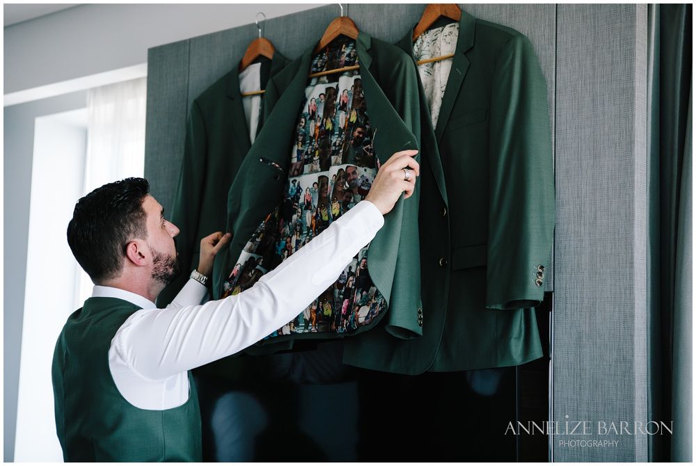 Goom looking at his suit jacket