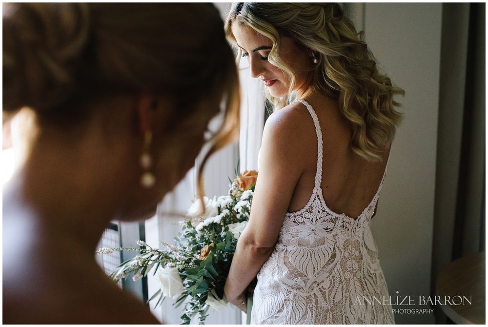 Bride looking over her shoulder before her COMO the Treasury wedding