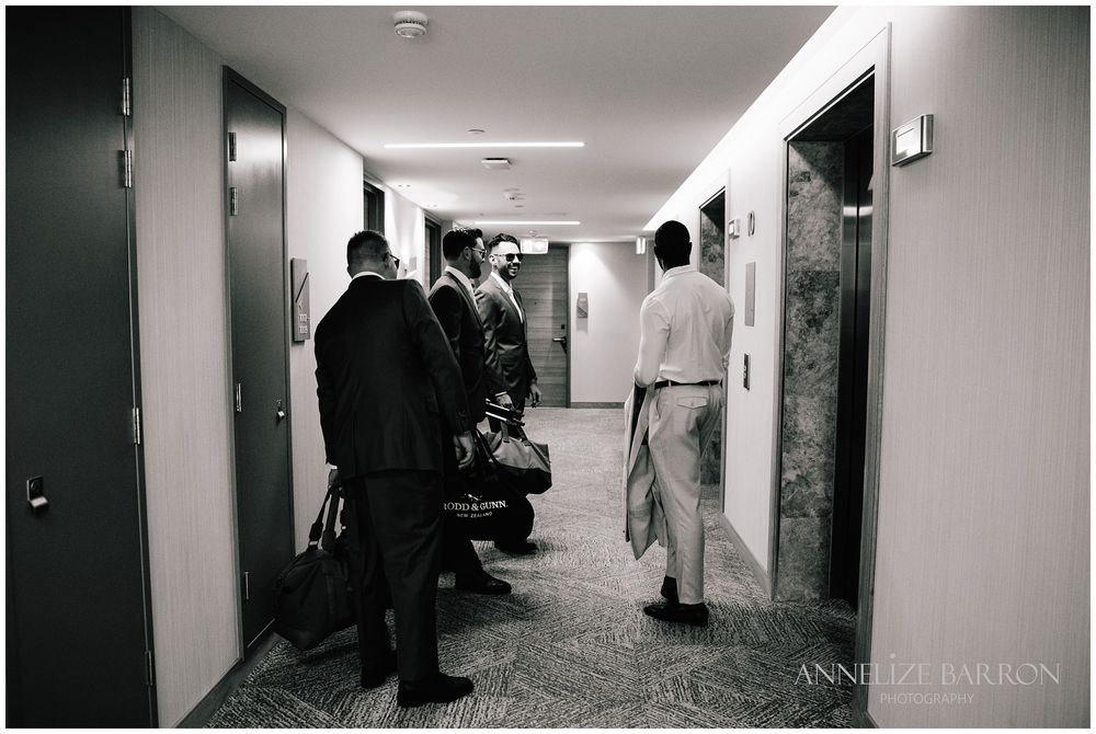 Groom and groomsmen departing the hotel for the first look