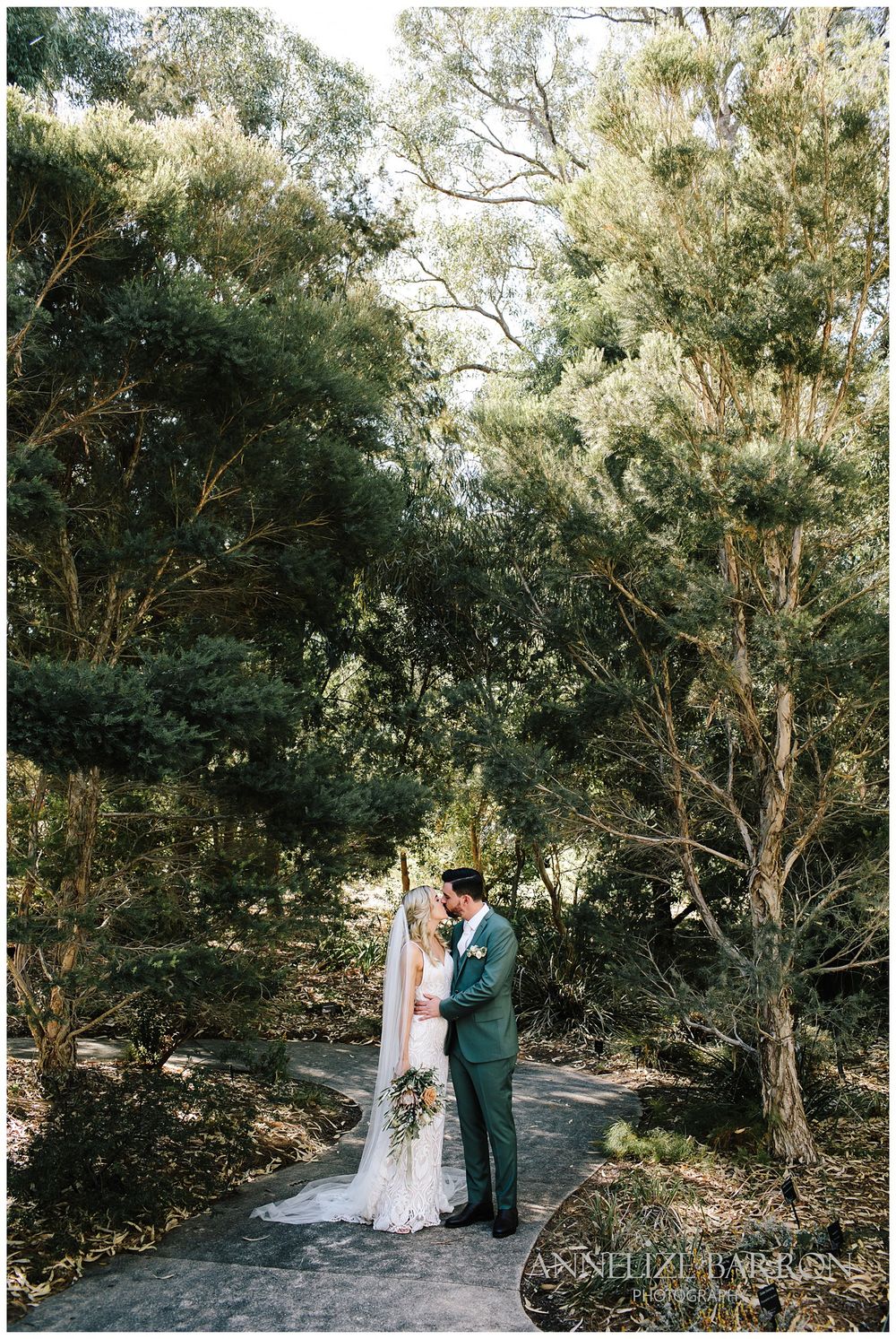 Bride and groom kissing in Kings Park