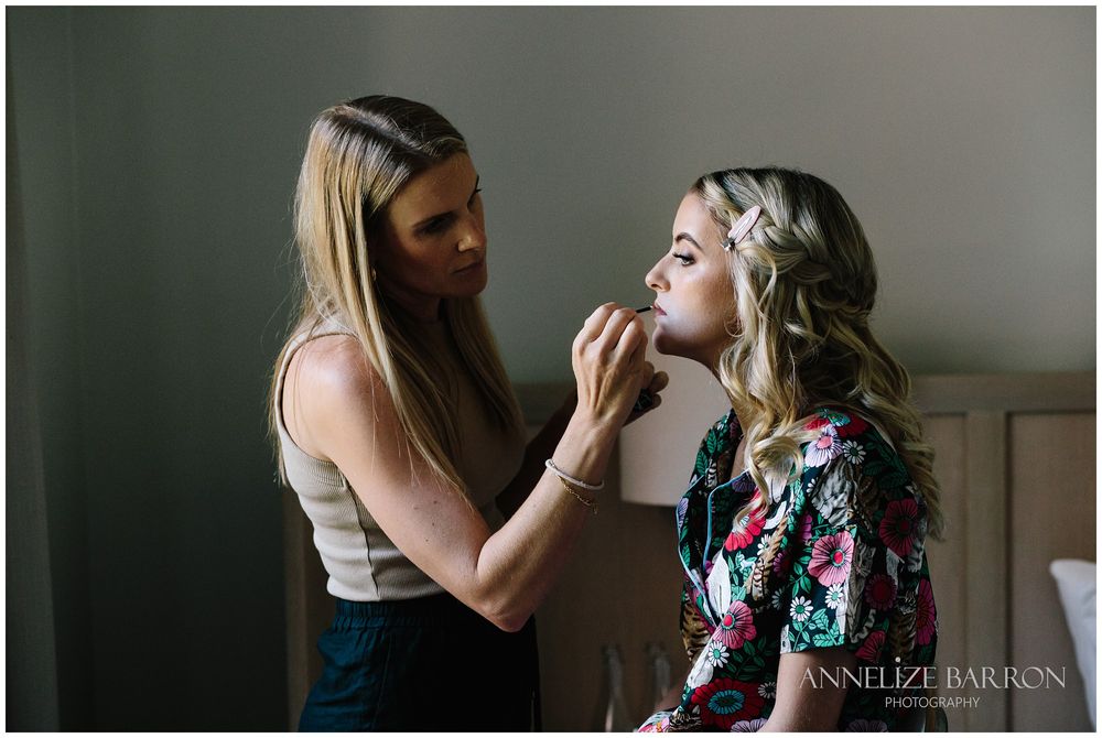 Bride getting her makeup on for her Como the Treasury wedding