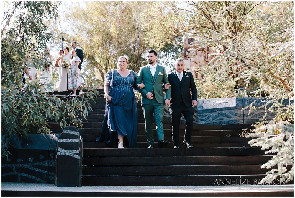 Mother and Father walking the groom down the isle