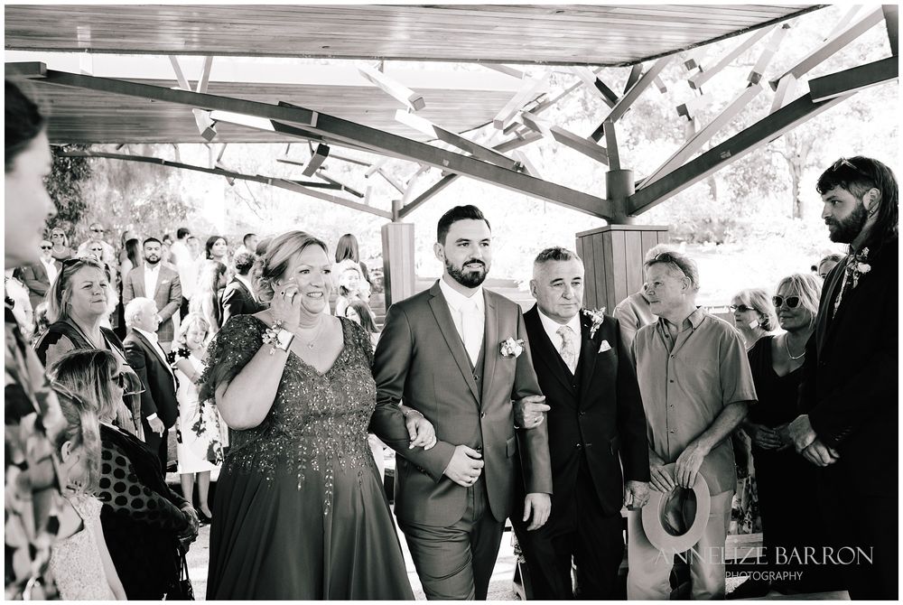 Mother and Father walking the groom down the isle