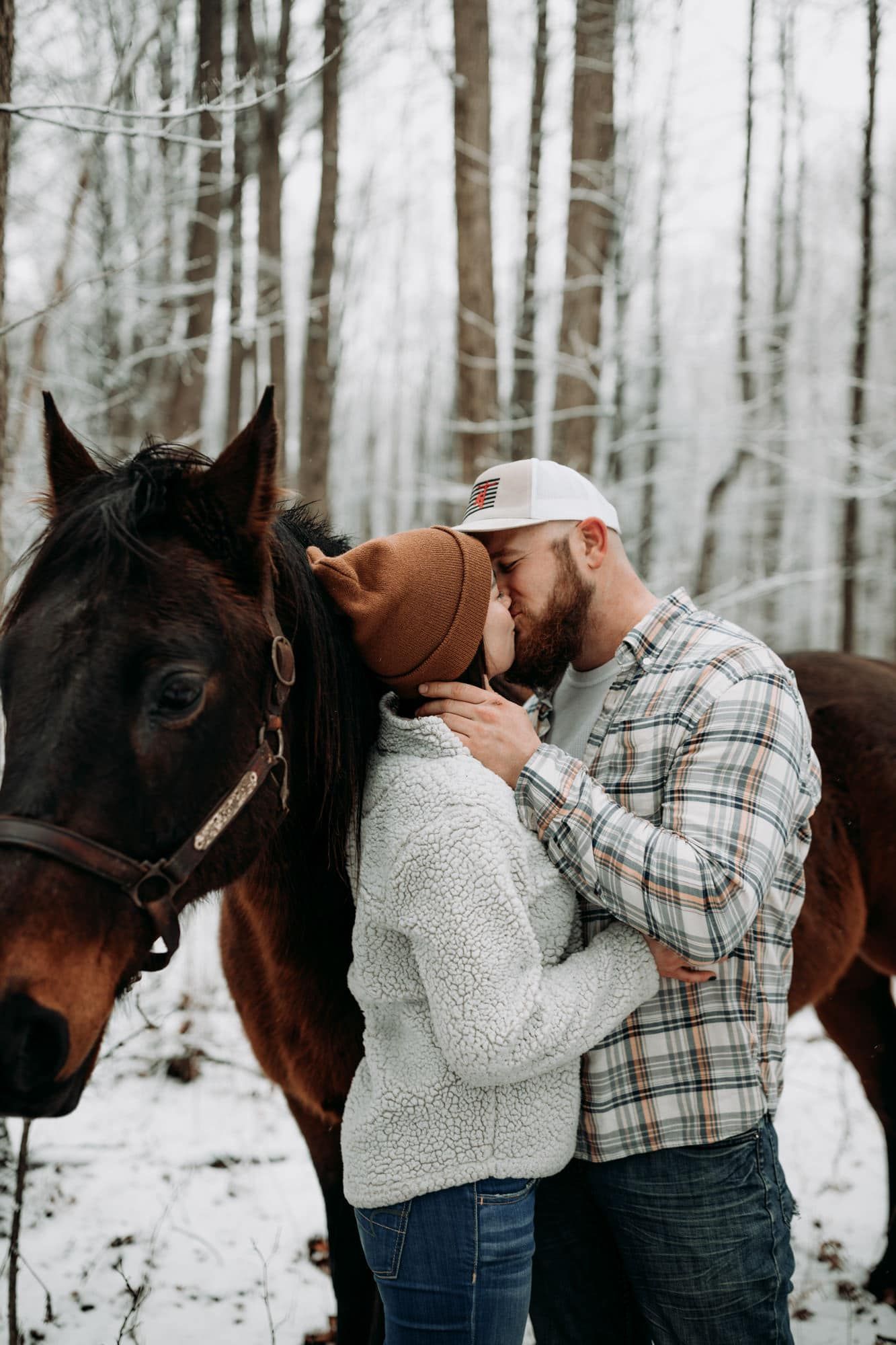 couple-kissing-engagement-session-oak-openings