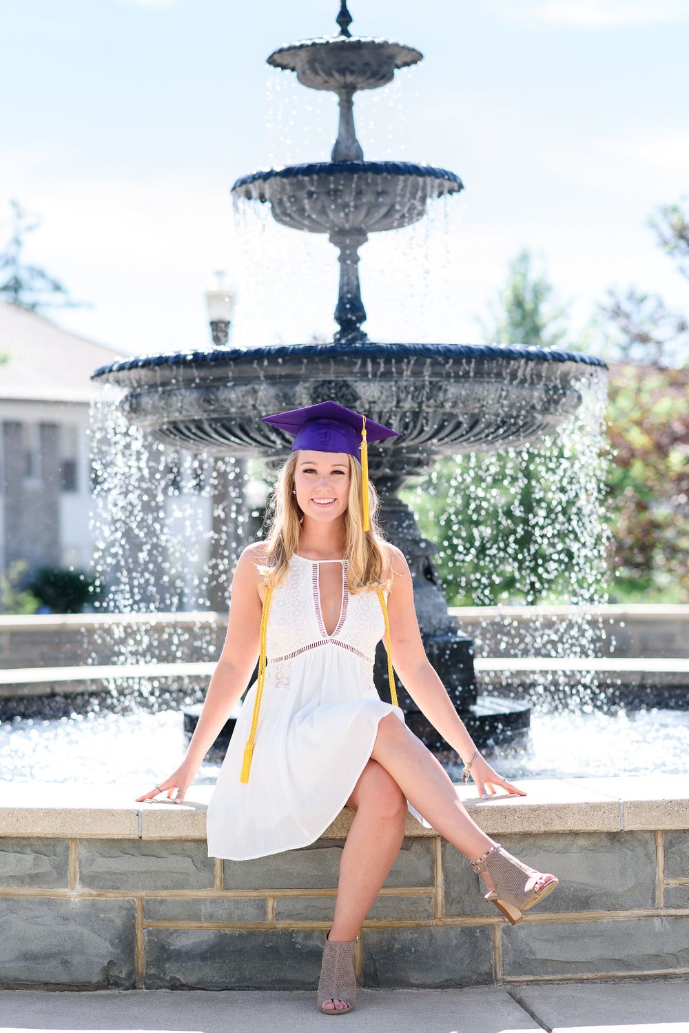 JMU Senior in front of fountain