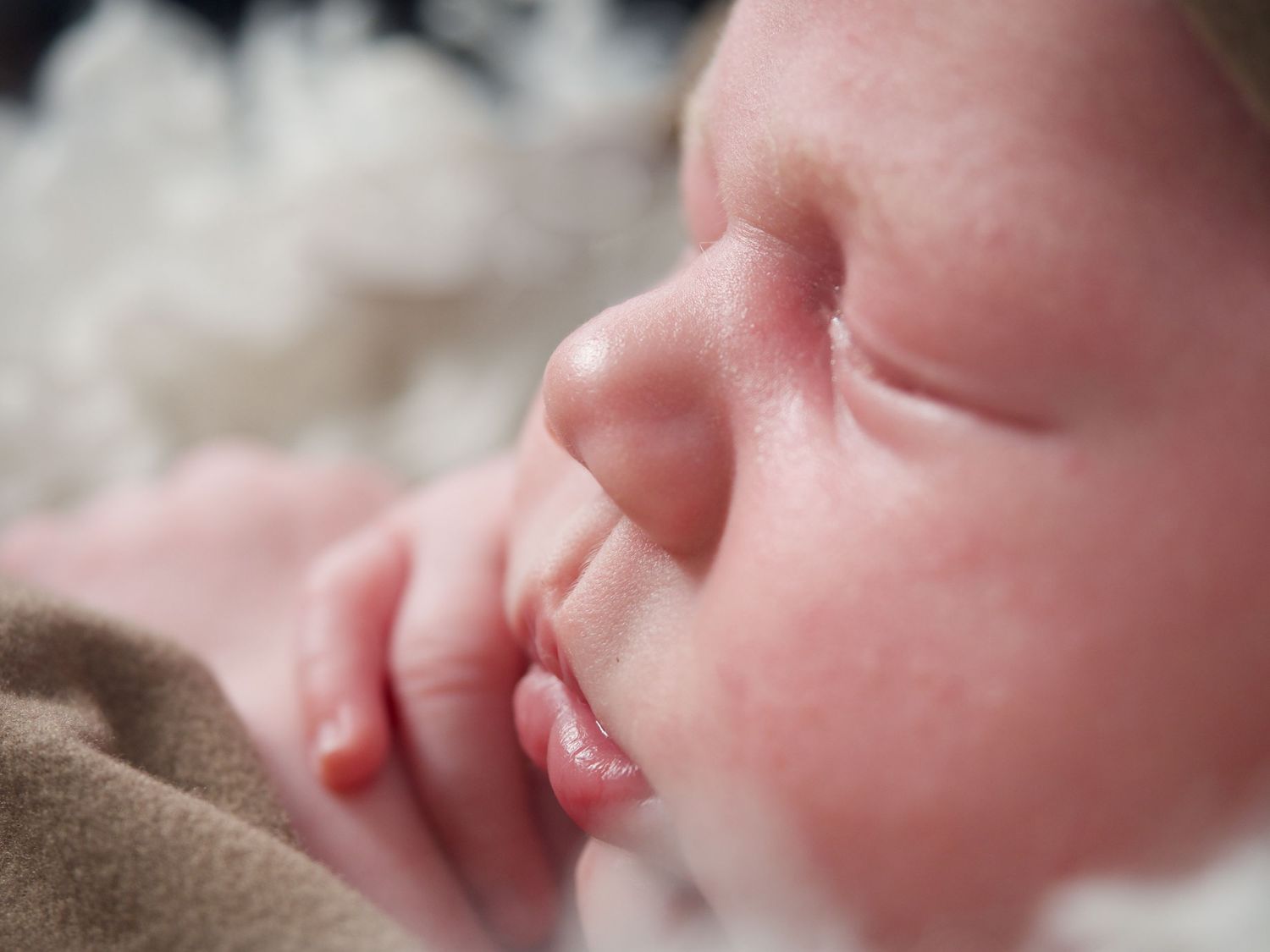 portrait of a baby boy close up so you can see the eyes nose and mouth details
