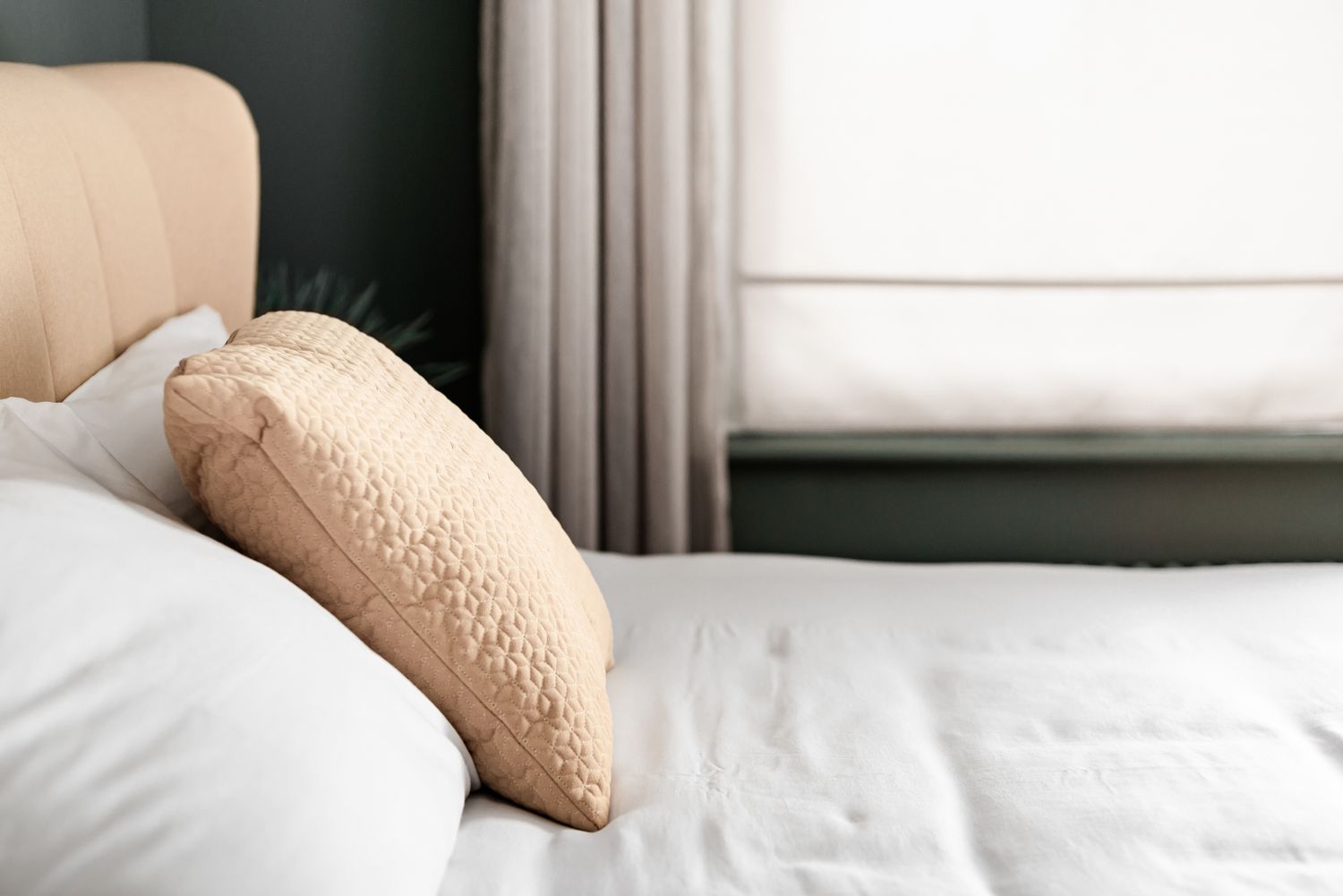 white bedding with yellow headboard and cushion. guesthouse photography