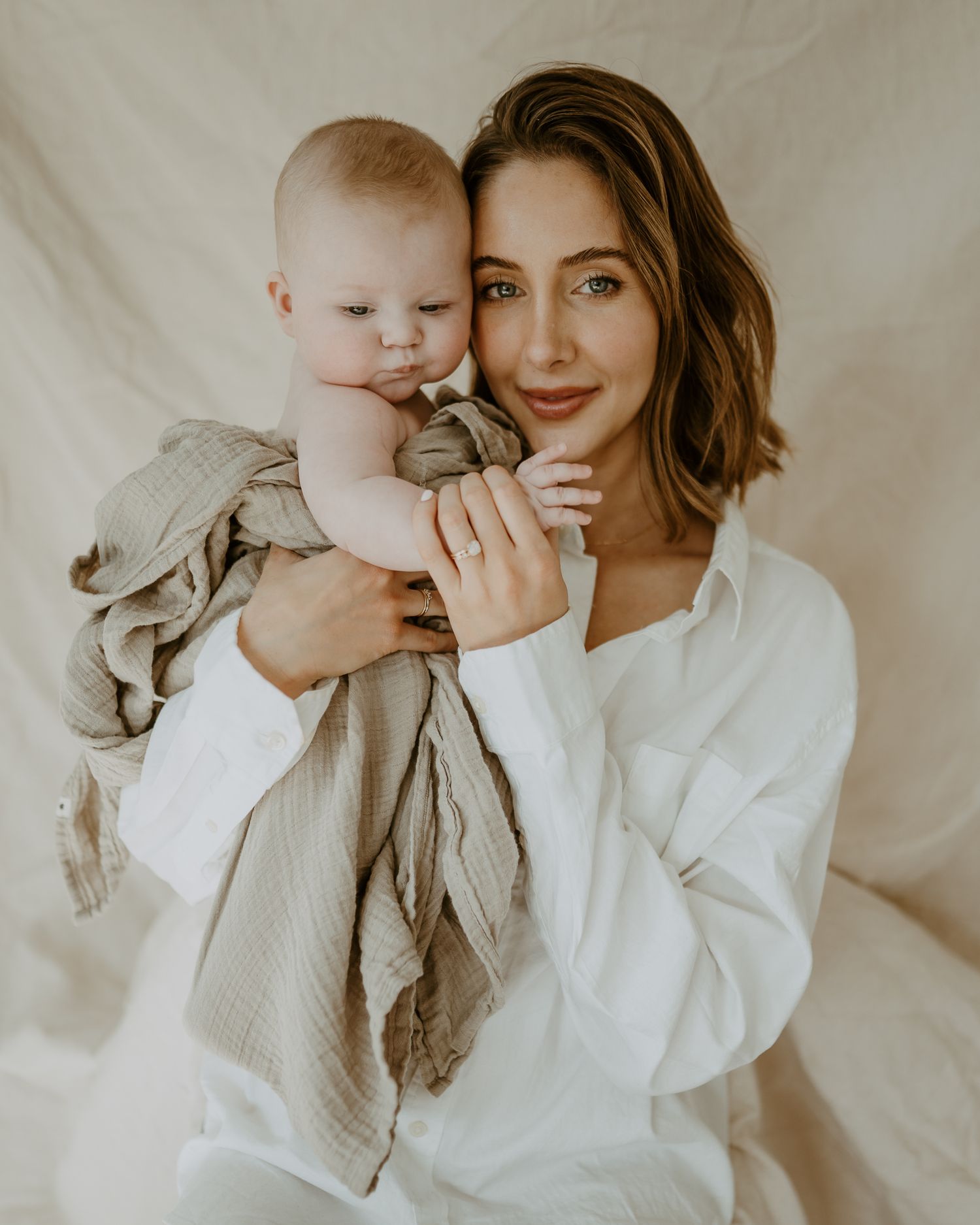 mother and toddler posing in studio