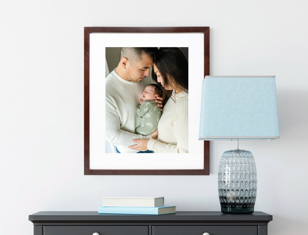 Living room with framed print of parents holding baby