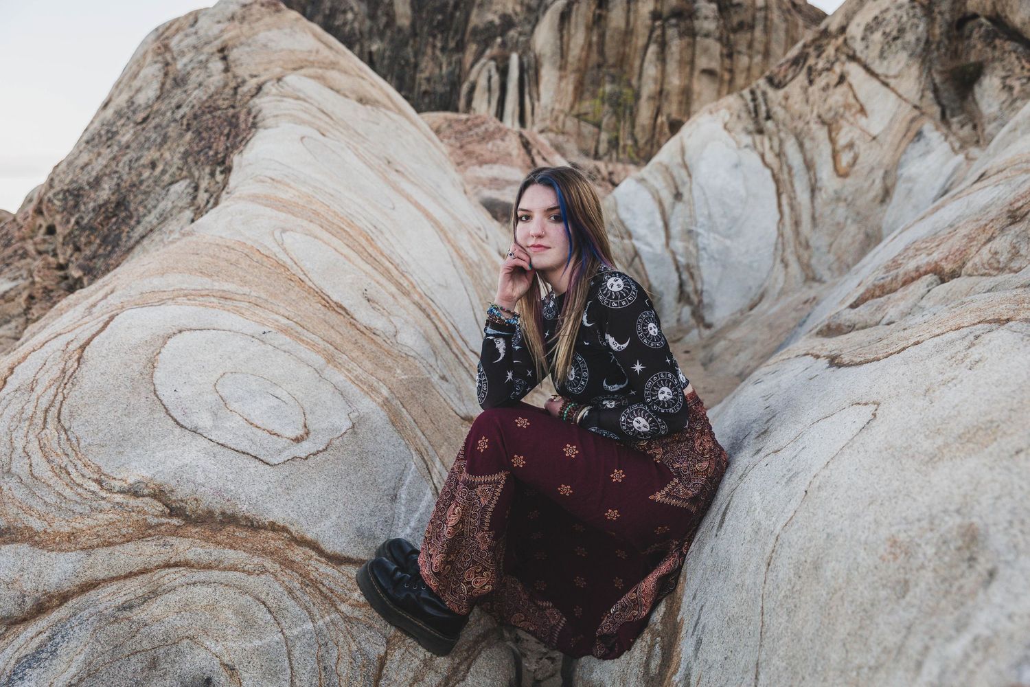 Moon Rocks Desert Nevada Senior Photo with pink and blue hair and black crop top and bohemian skirt Dr. Marten boots