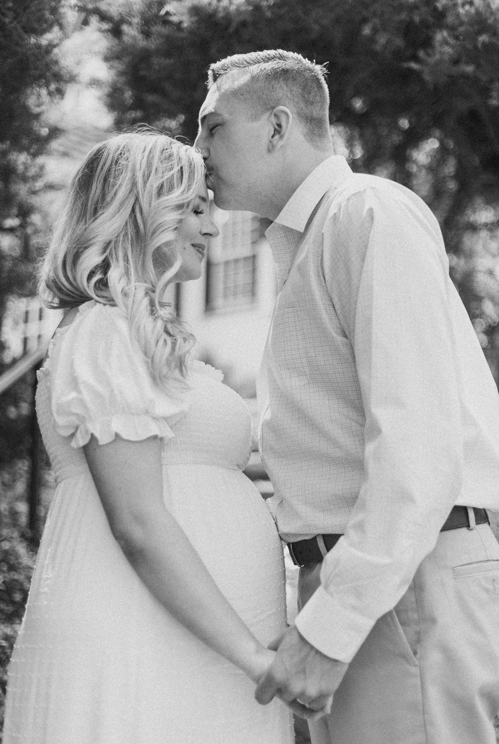 Sweet maternity photo showing an intimate moment between expectant parents.