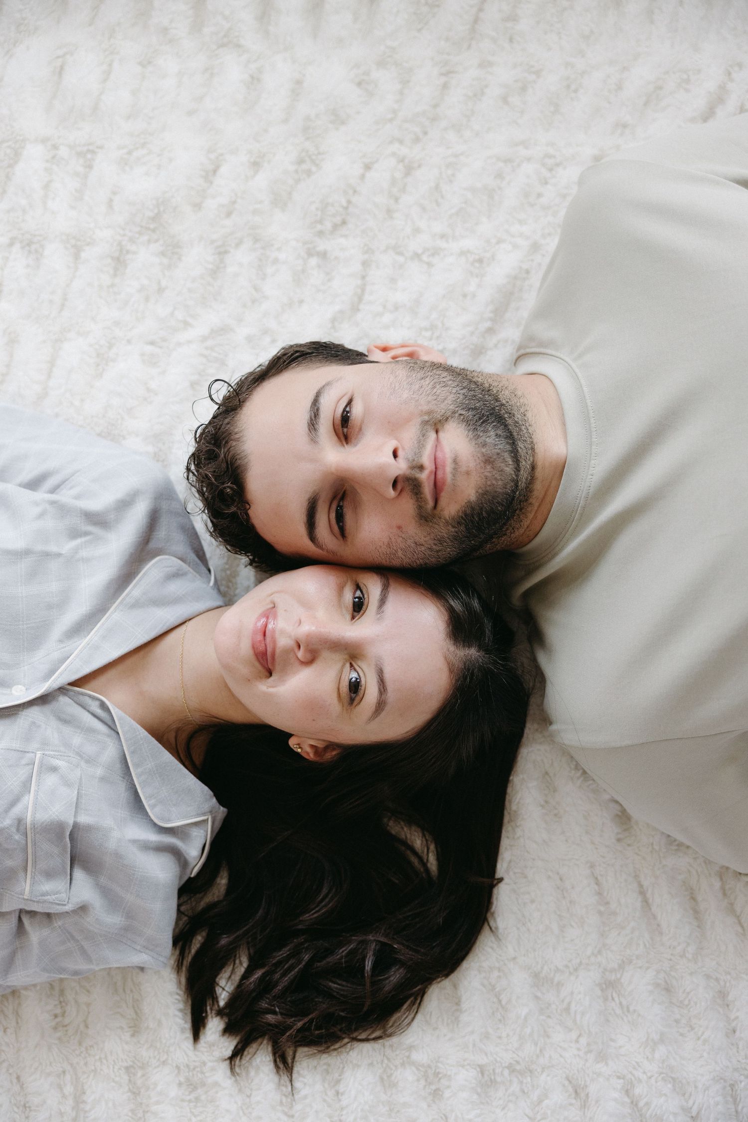 couple laying on the floor looking at the camera couples photography Leticia Souza photography