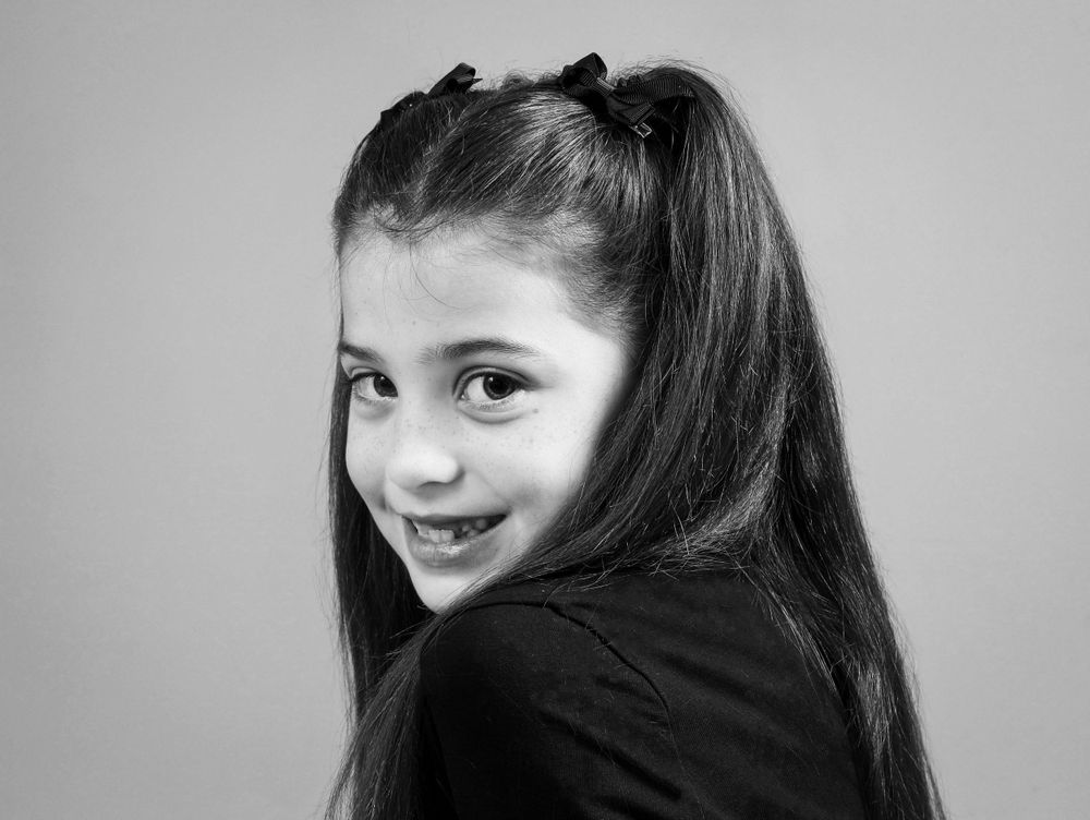Black and White headshot. Young girl.