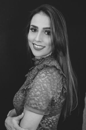 Black and white portraits showing textured lace top styling with natural makeup look.