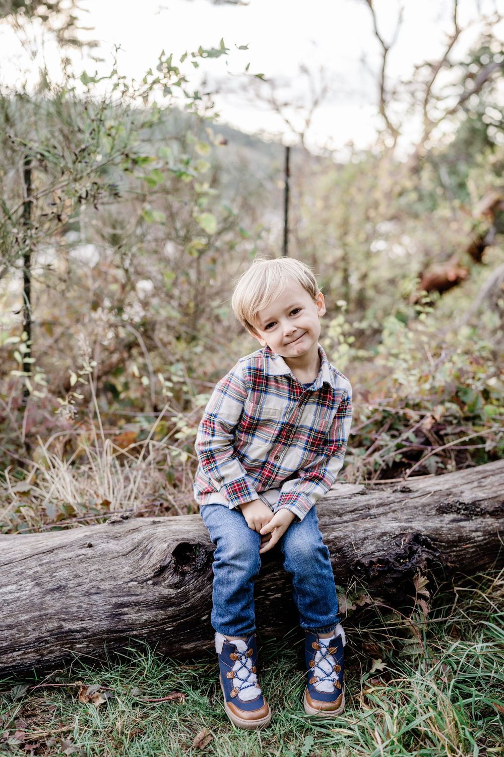 fall family photographer c photography sunset photo of boy sitting on a log