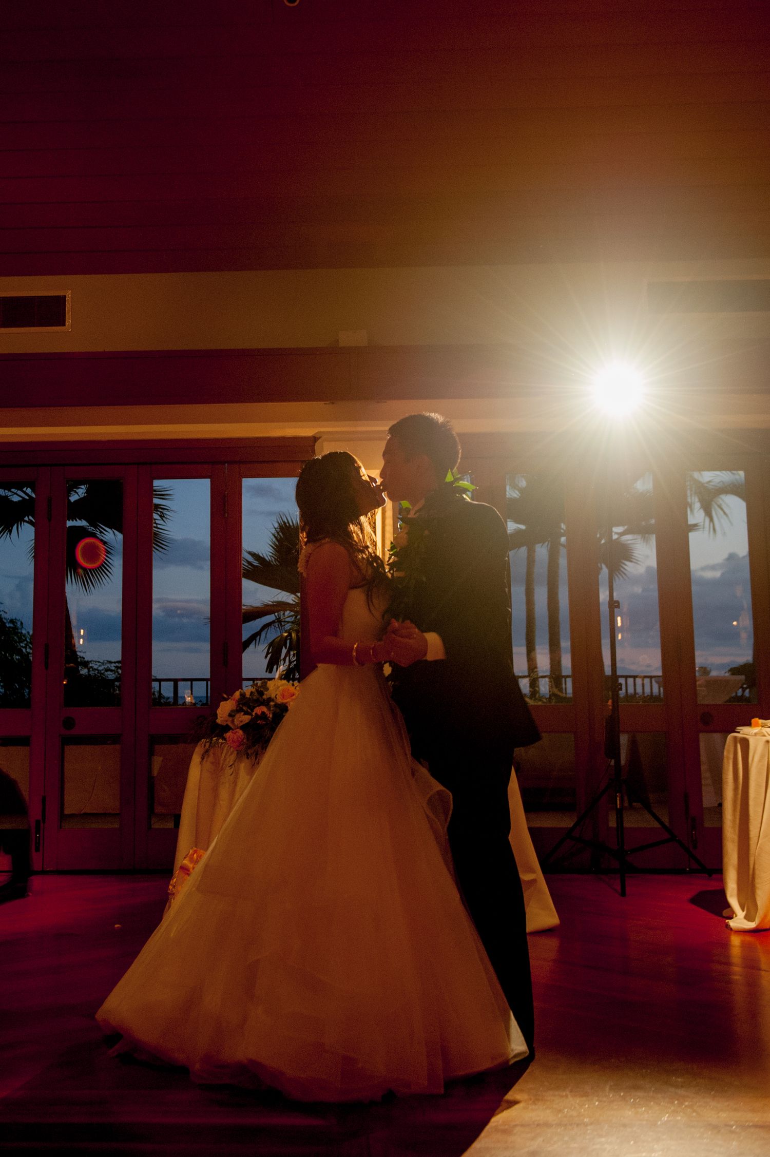 wedding couple dancing at night at Halekulani hotel, waikiki.