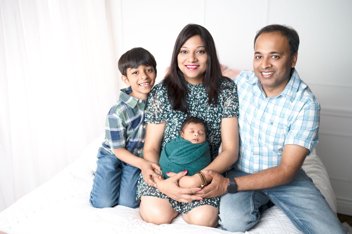 Candid family portrait series showing loving moments together against white backdrop.