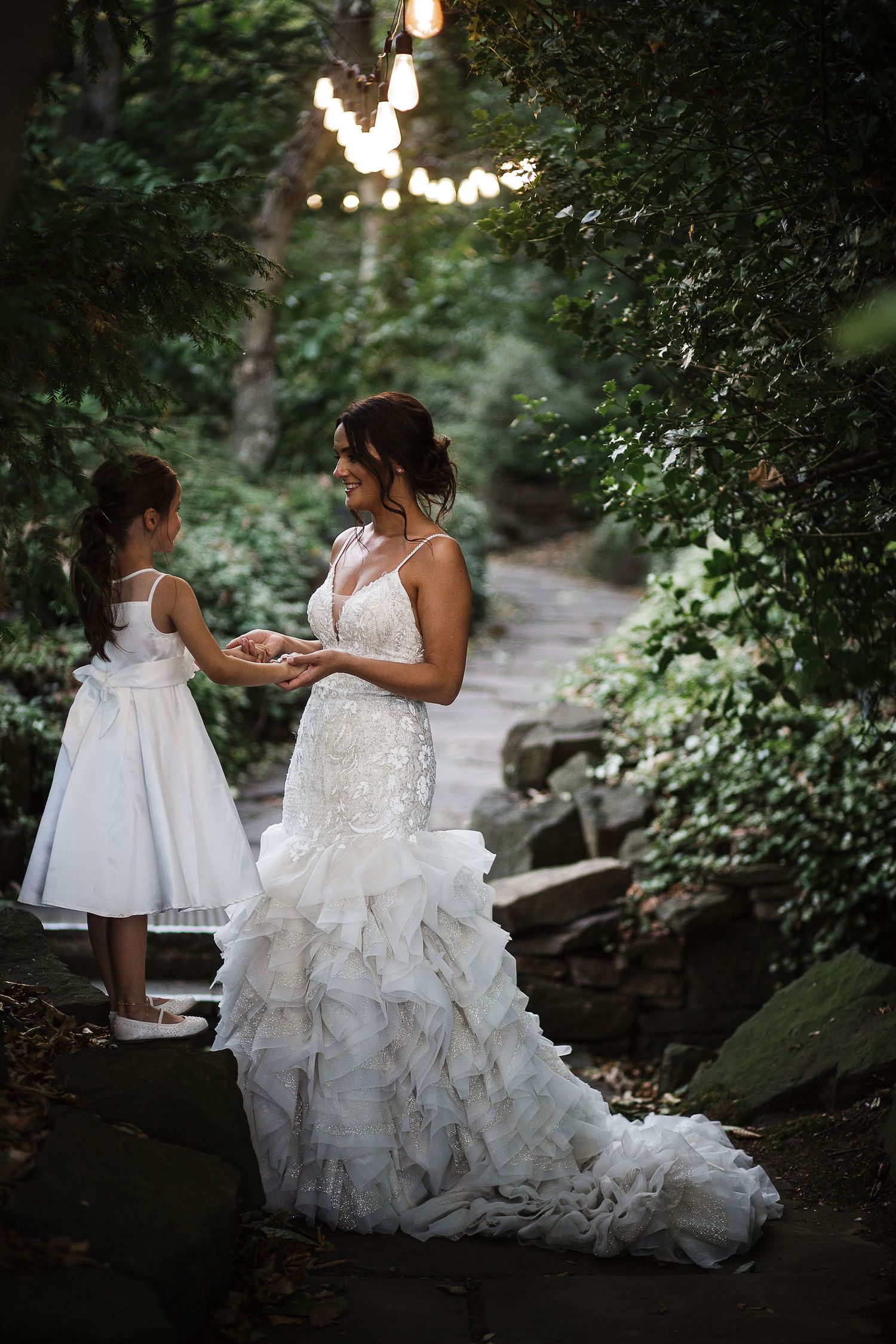 Wedding dress photo sequence showing intimate mother and daughter moment in a lush garden setting.