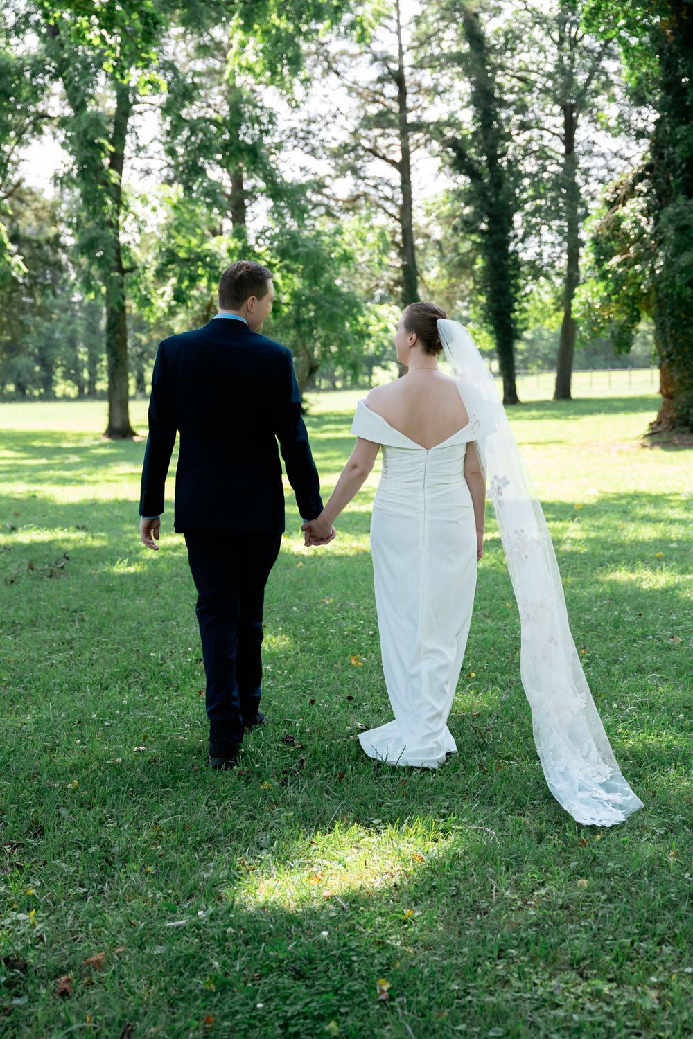 Outdoor elopement photography session with couple walking away in Charlottesville, Virginia